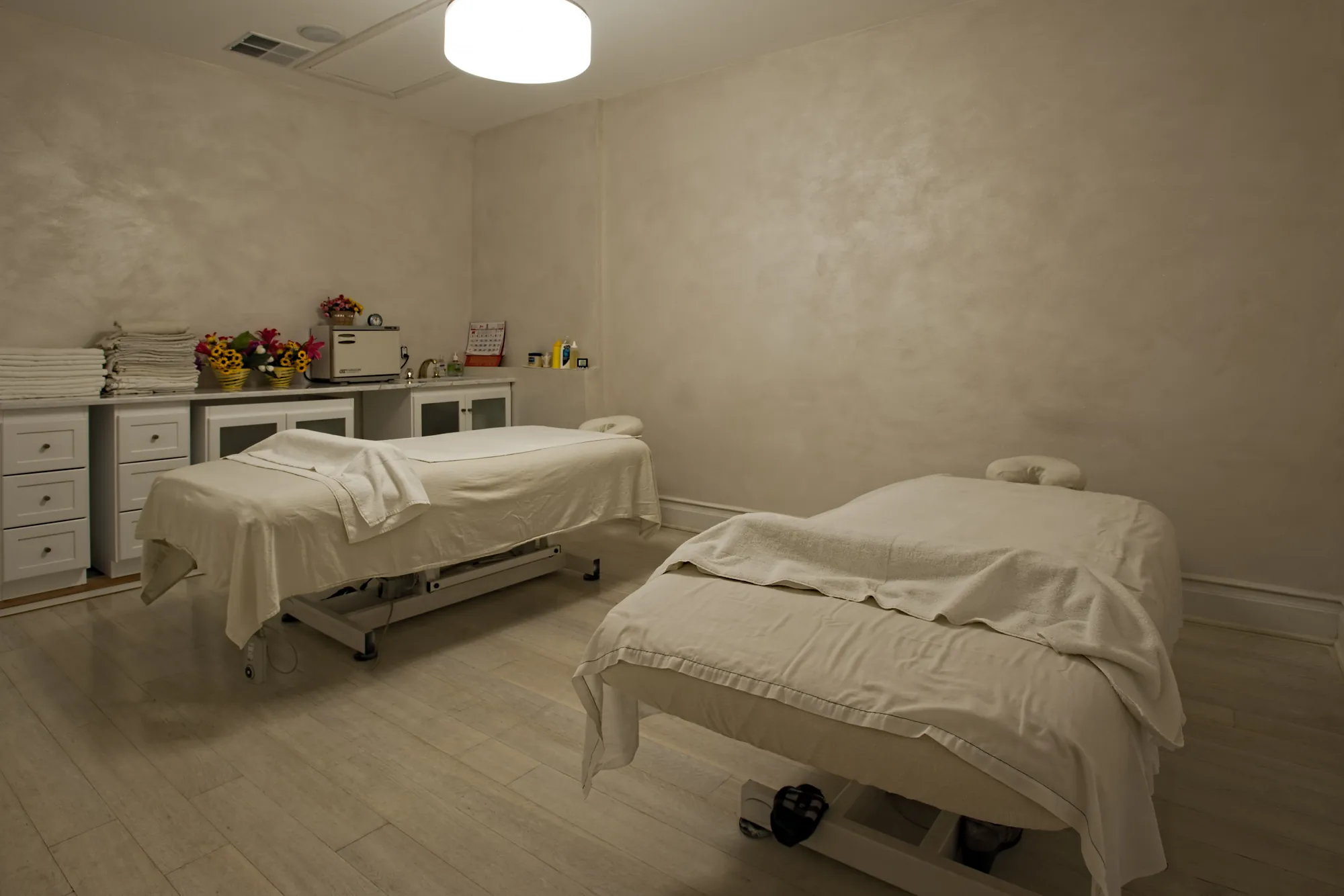A treatment room with two tables.
