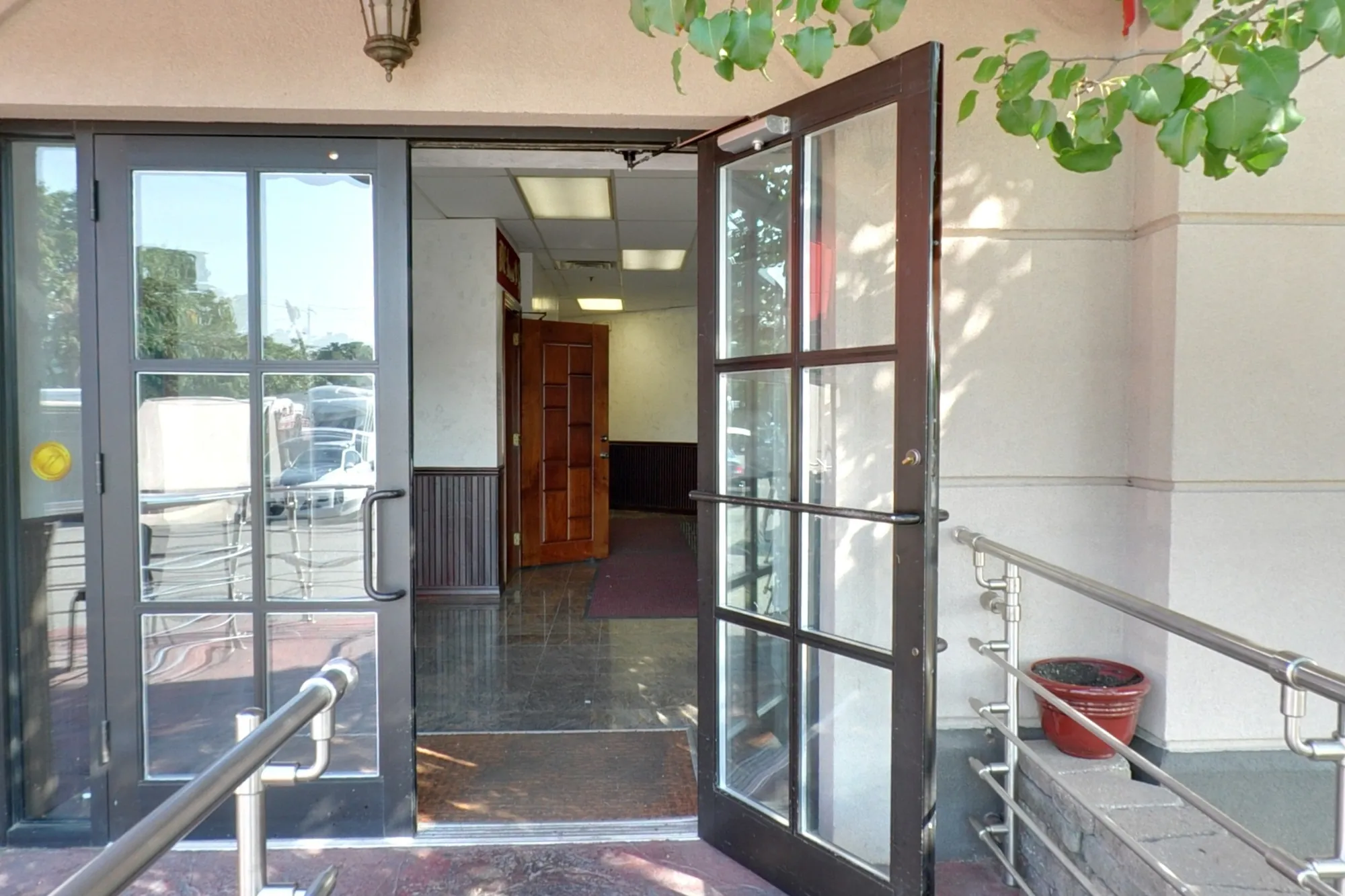 The front door of BRC under its red awning, a lamp above the entrance.