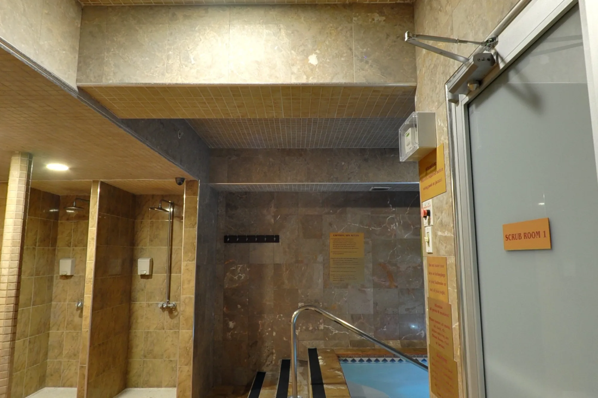 Showers and the plunge, off the sauna corridor.